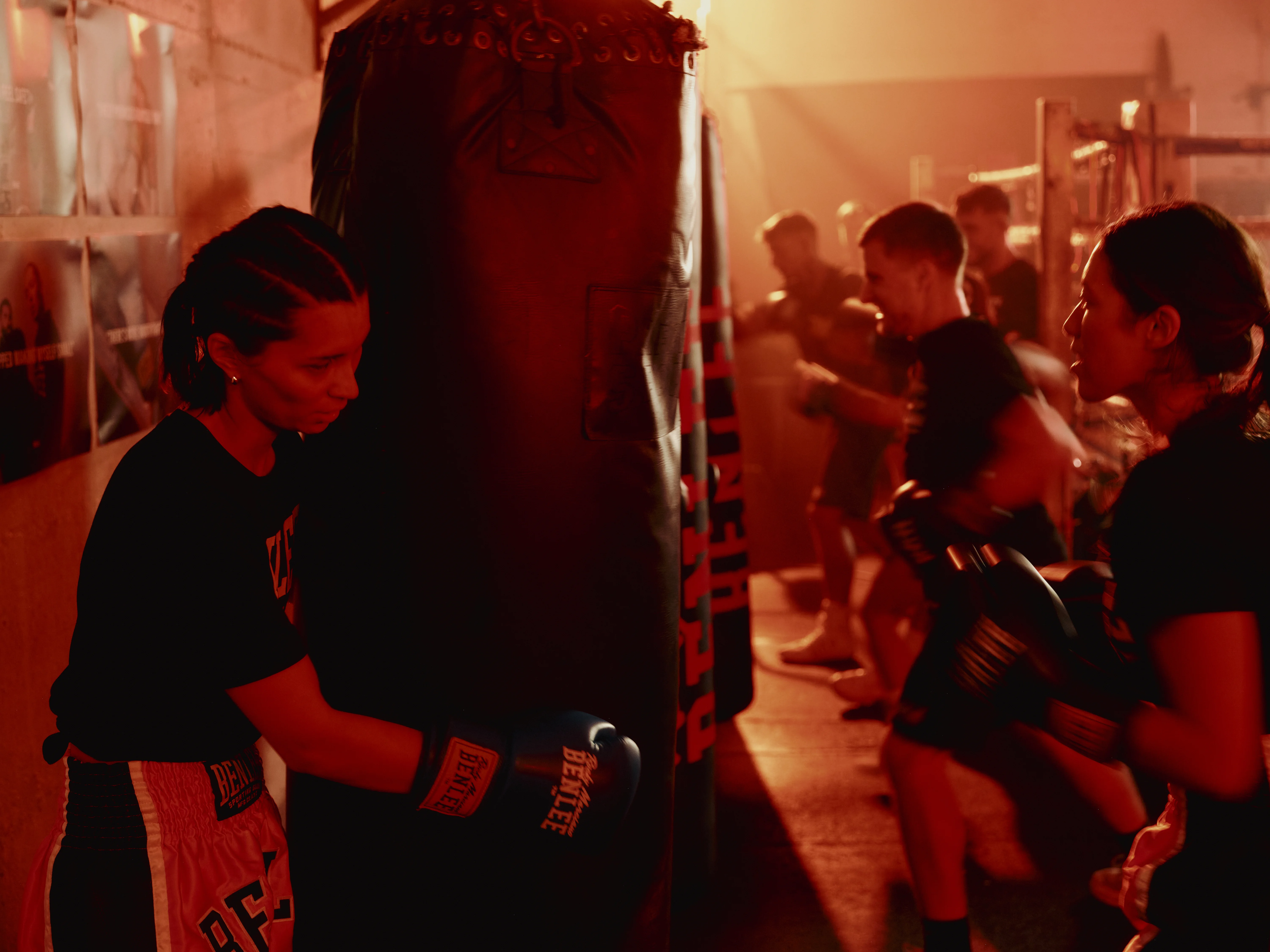 Community training at heavy bags in red light