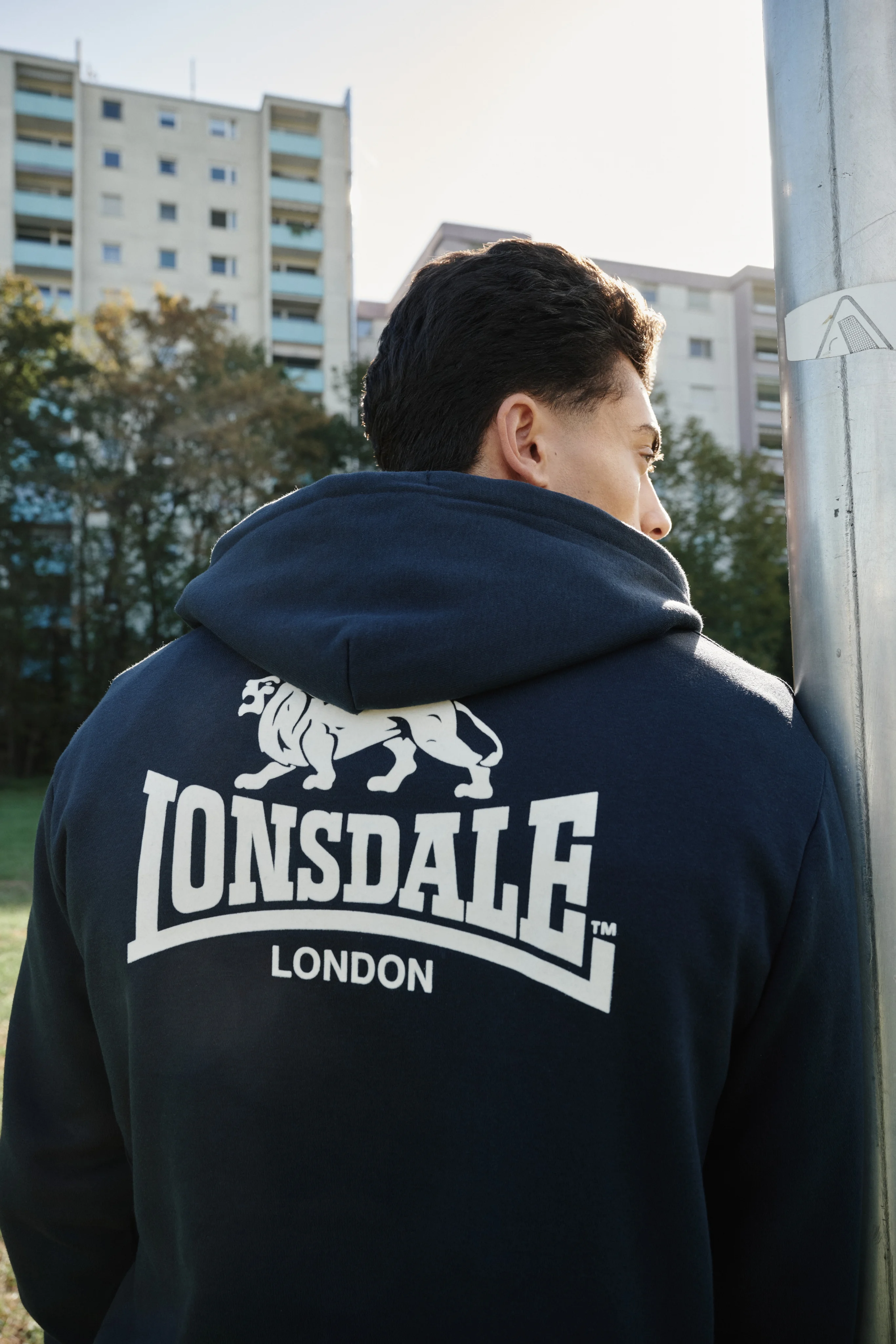 Back of a navy hoodie with the white Lonsdale London logo