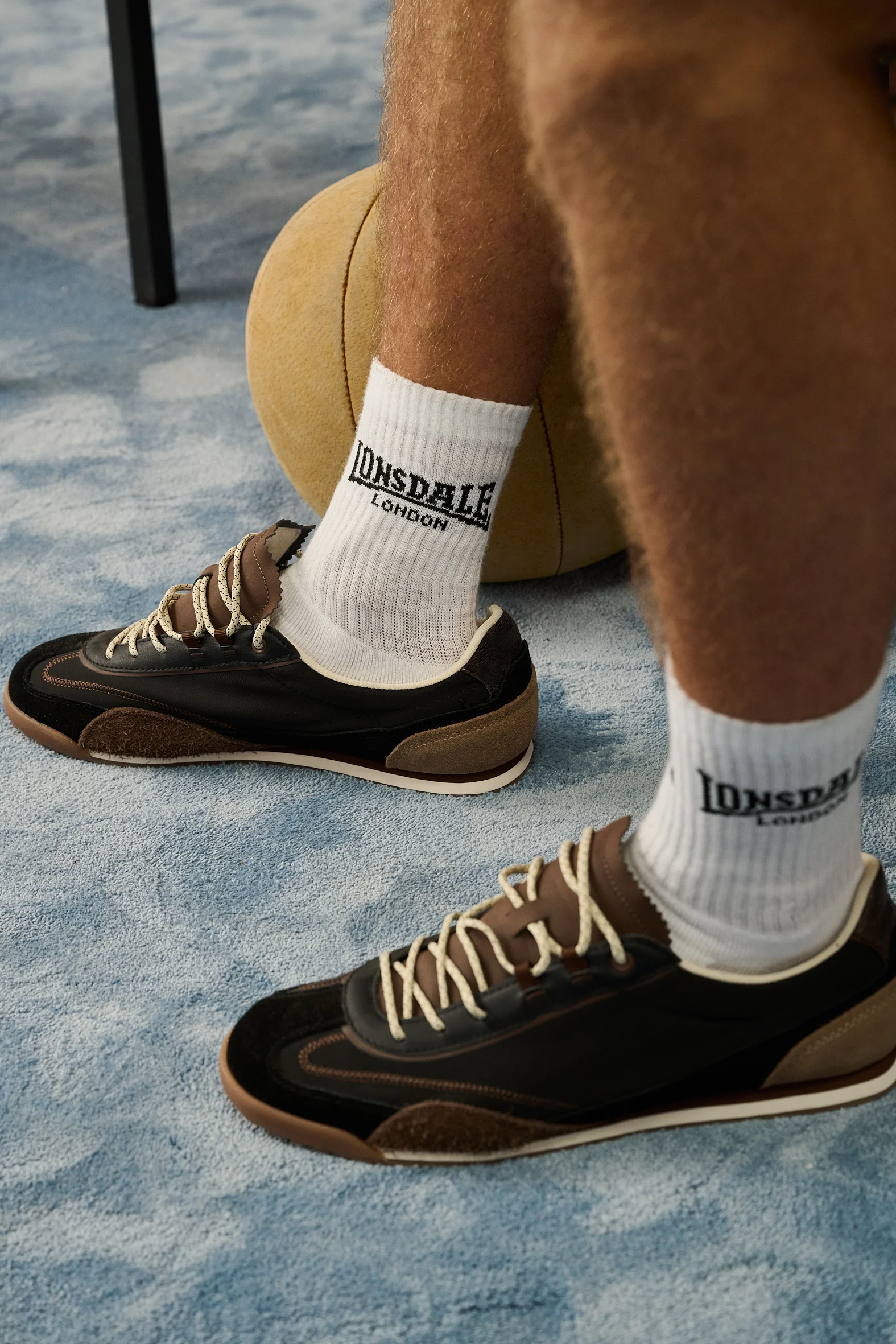White Lonsdale socks and dark sneakers, close-up