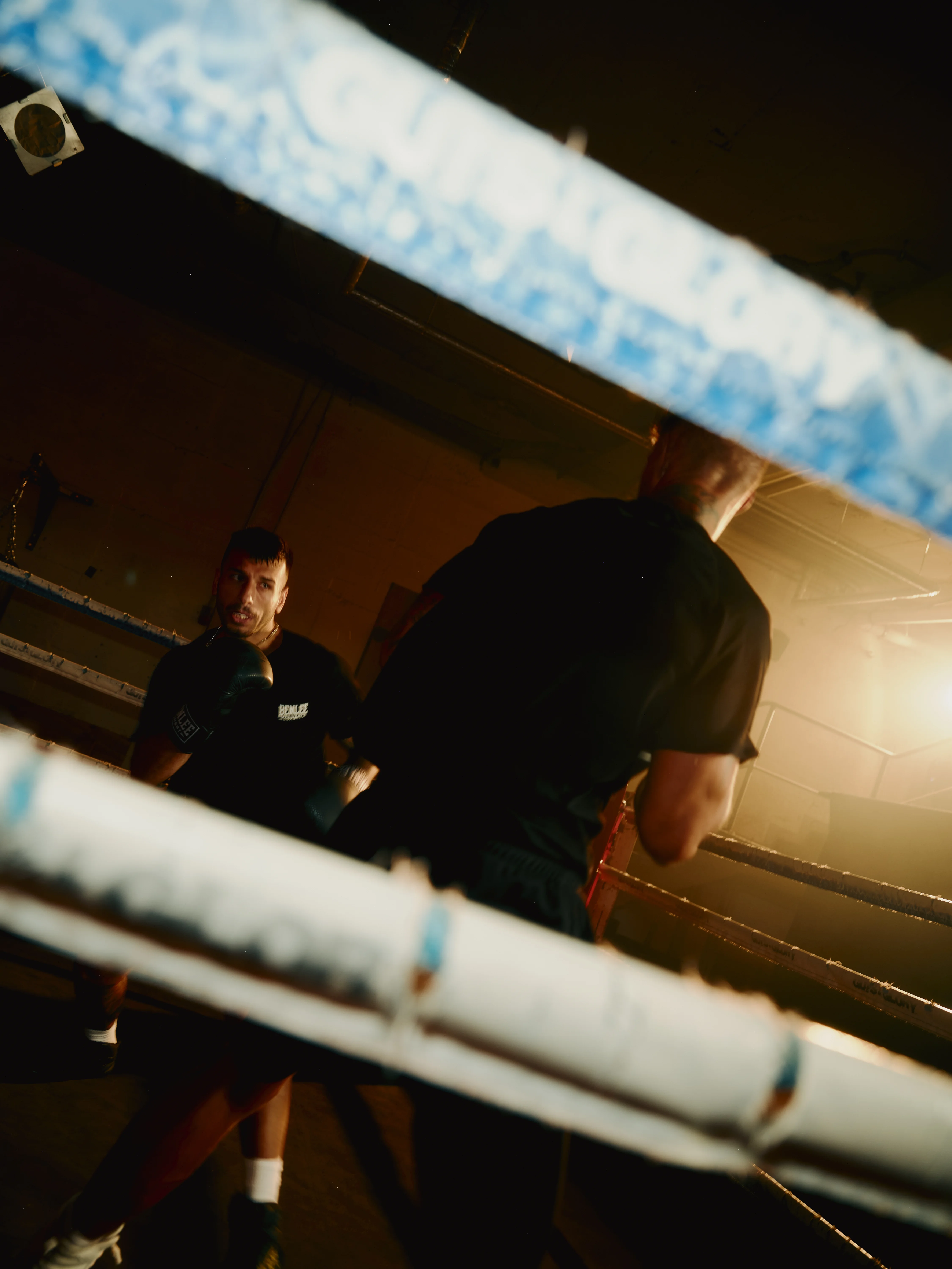 Boxers in the ring behind the ropes