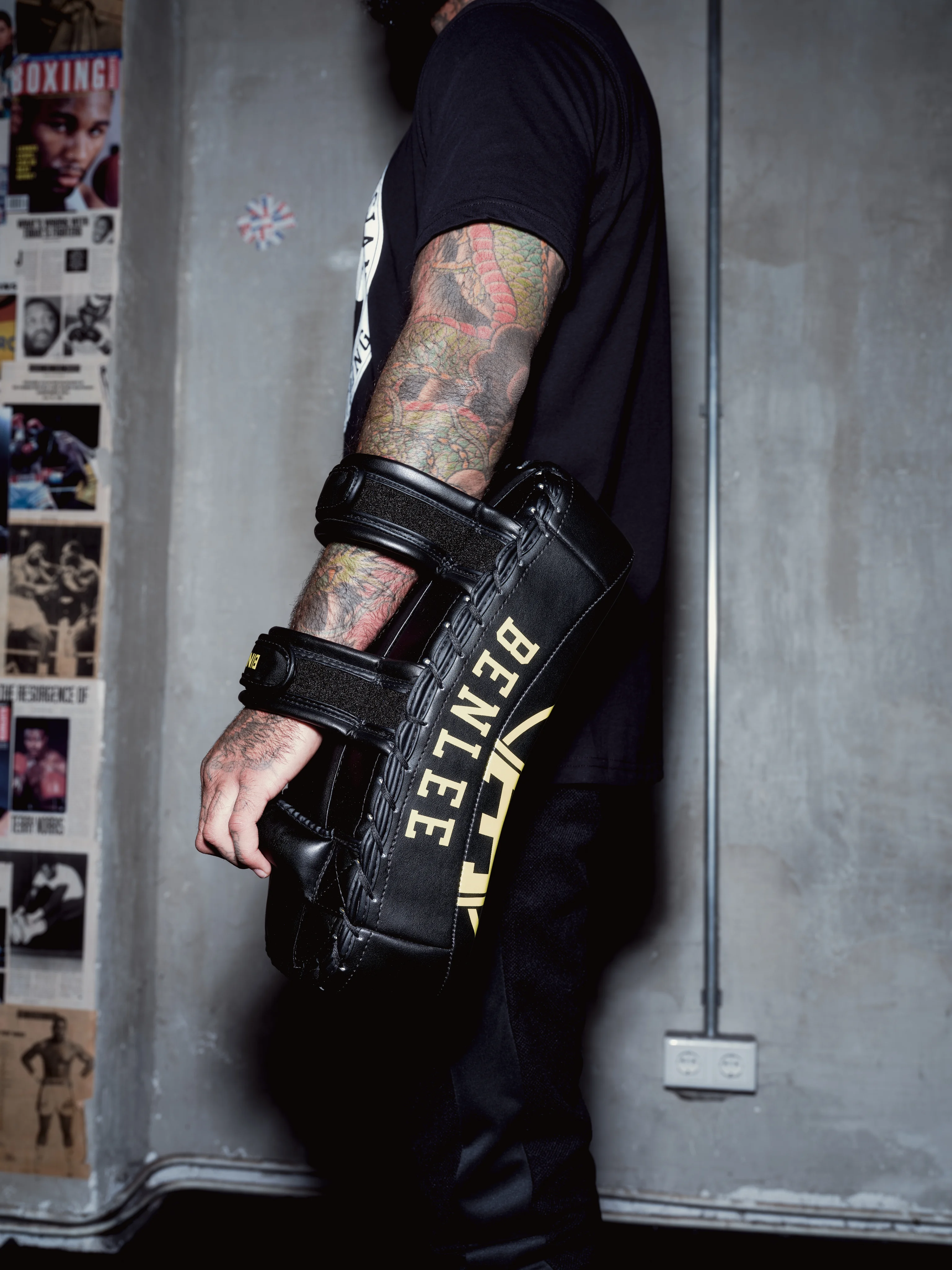 Boxer holding a BENLEE punch pad