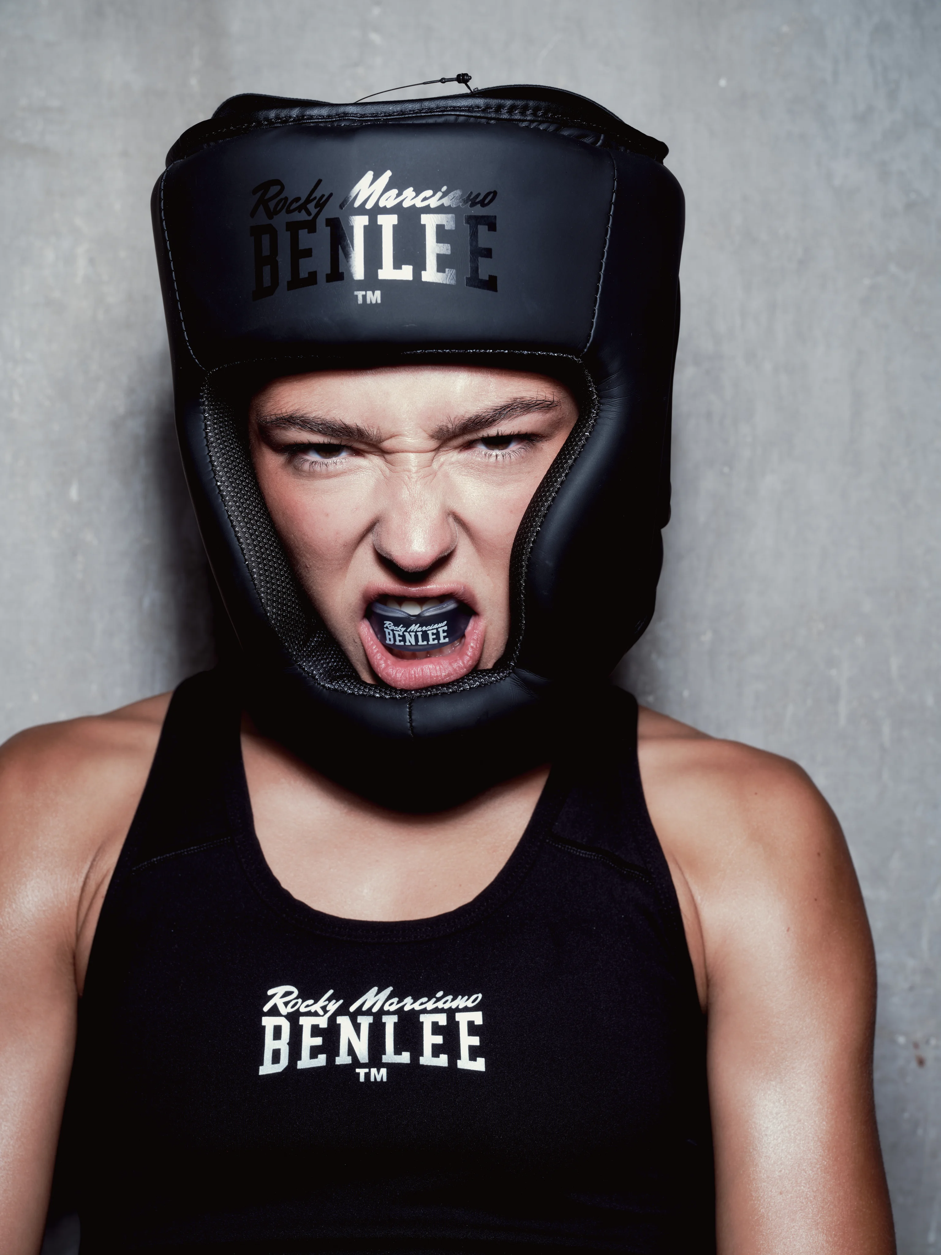 Boxer in BENLEE headgear with a mouthguard