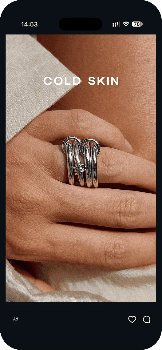 Cold Skin ad: hand with a stacked silver ring