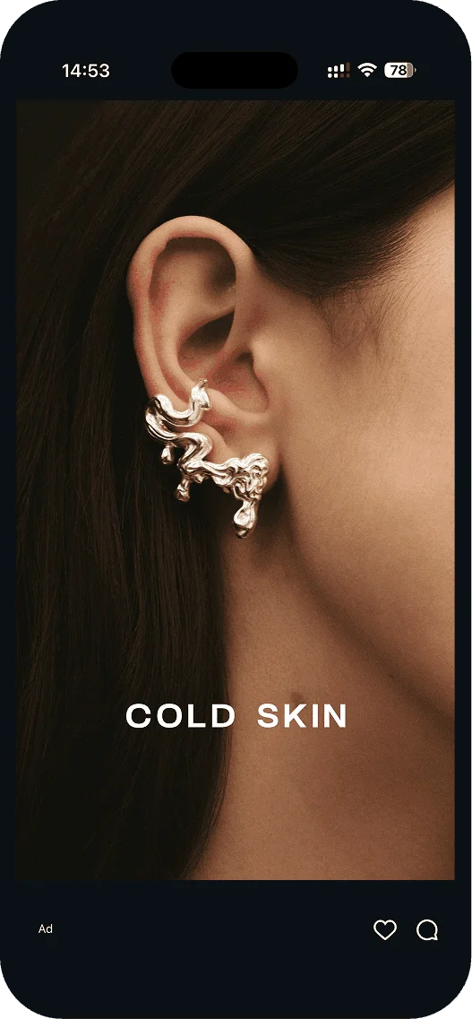 Cold Skin ad: sculptural silver ear cuff on a woman’s ear