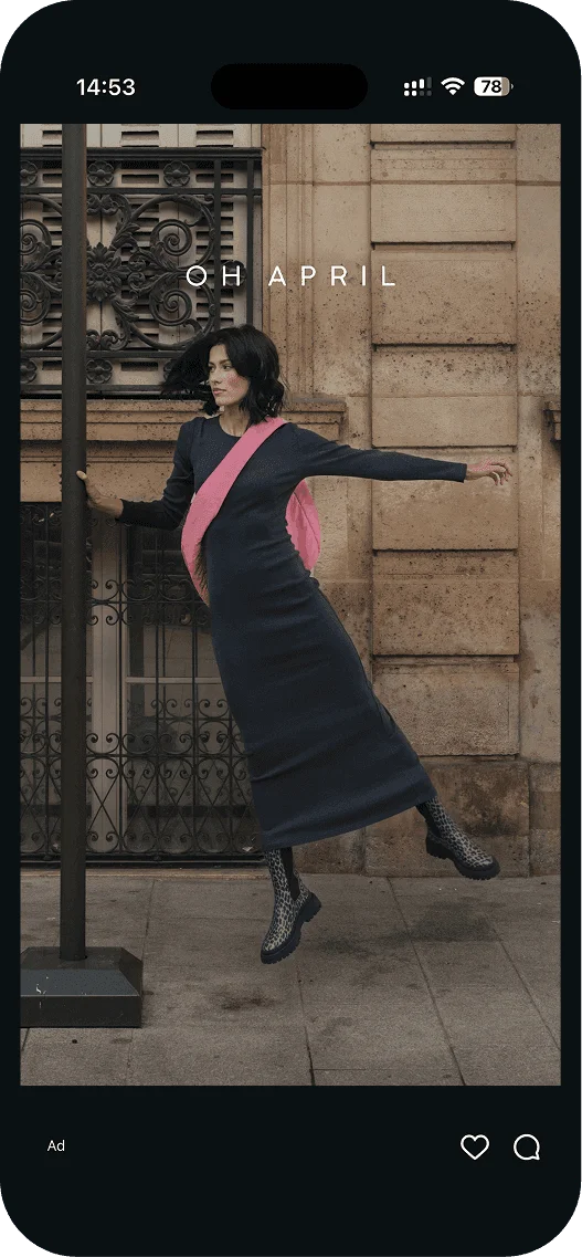 Oh April ad: model in a black dress in front of a building