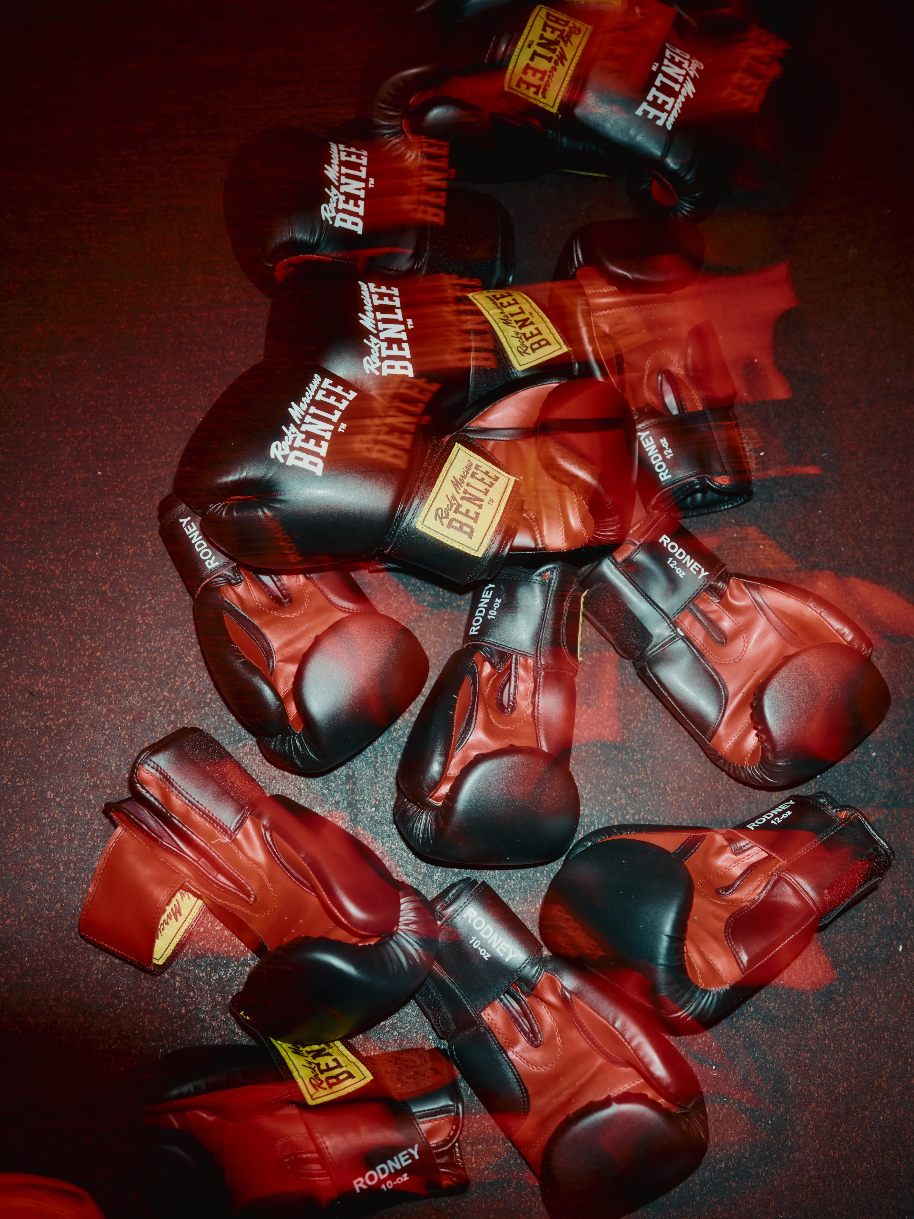 Pile of red BENLEE boxing gloves