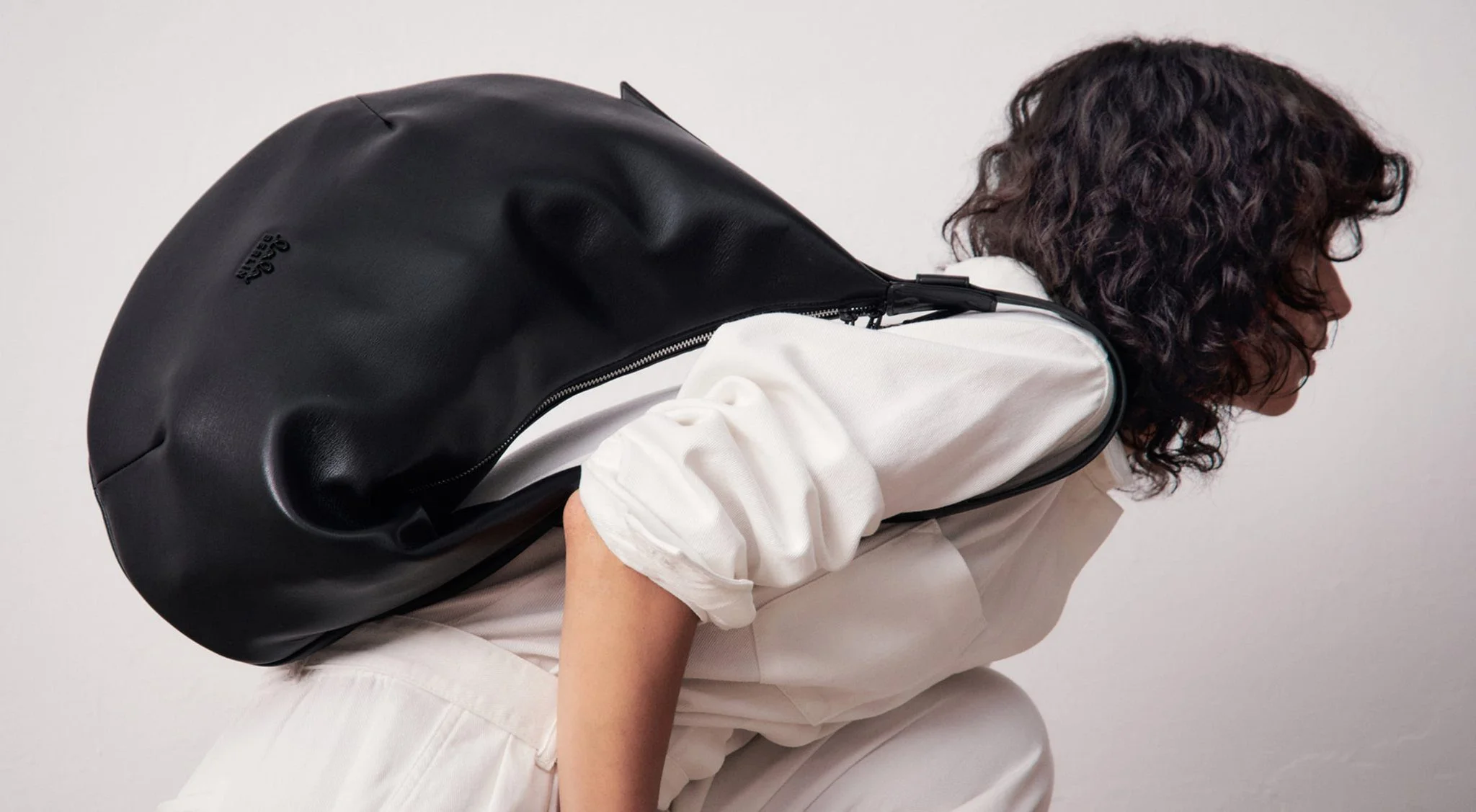 Lala Berlin campaign: model carrying a large black leather bag