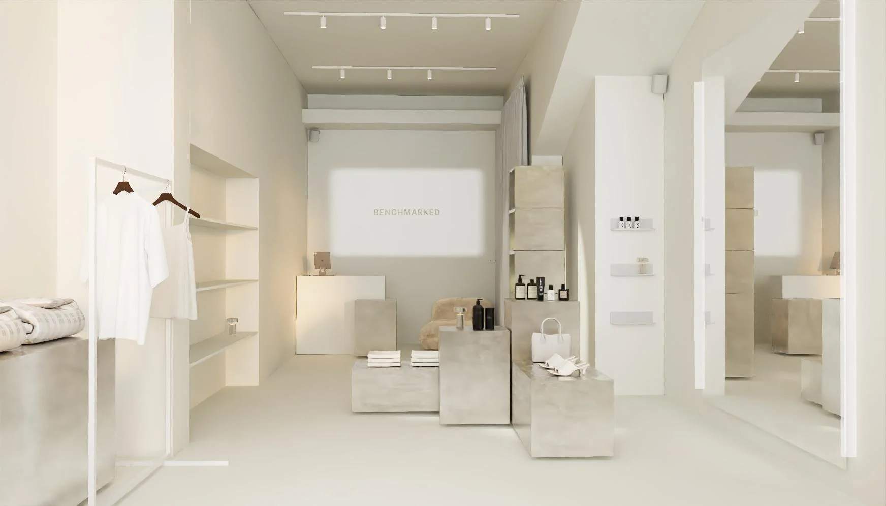 The retail space with shelves, display cubes and a clothing rail