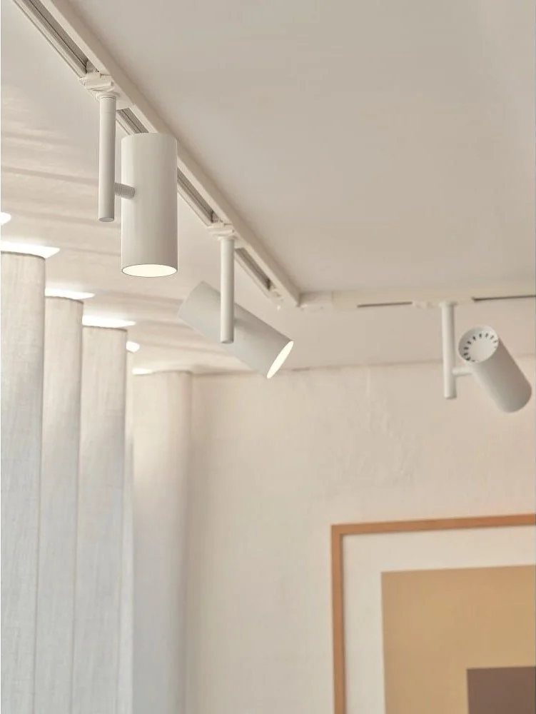 Adjustable spotlights on a ceiling track