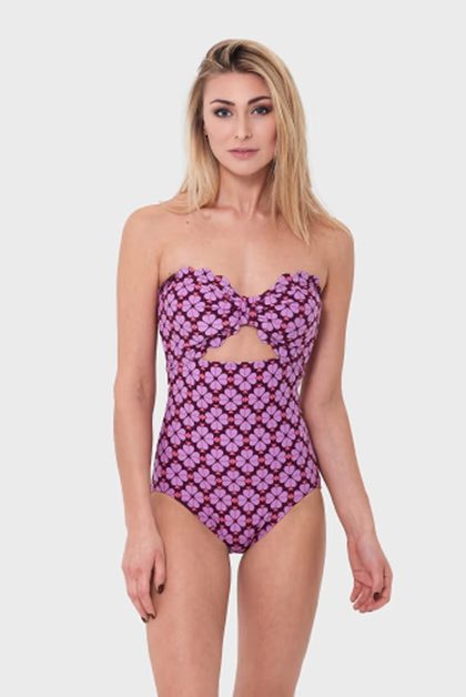 Woman in purple patterned swimsuit