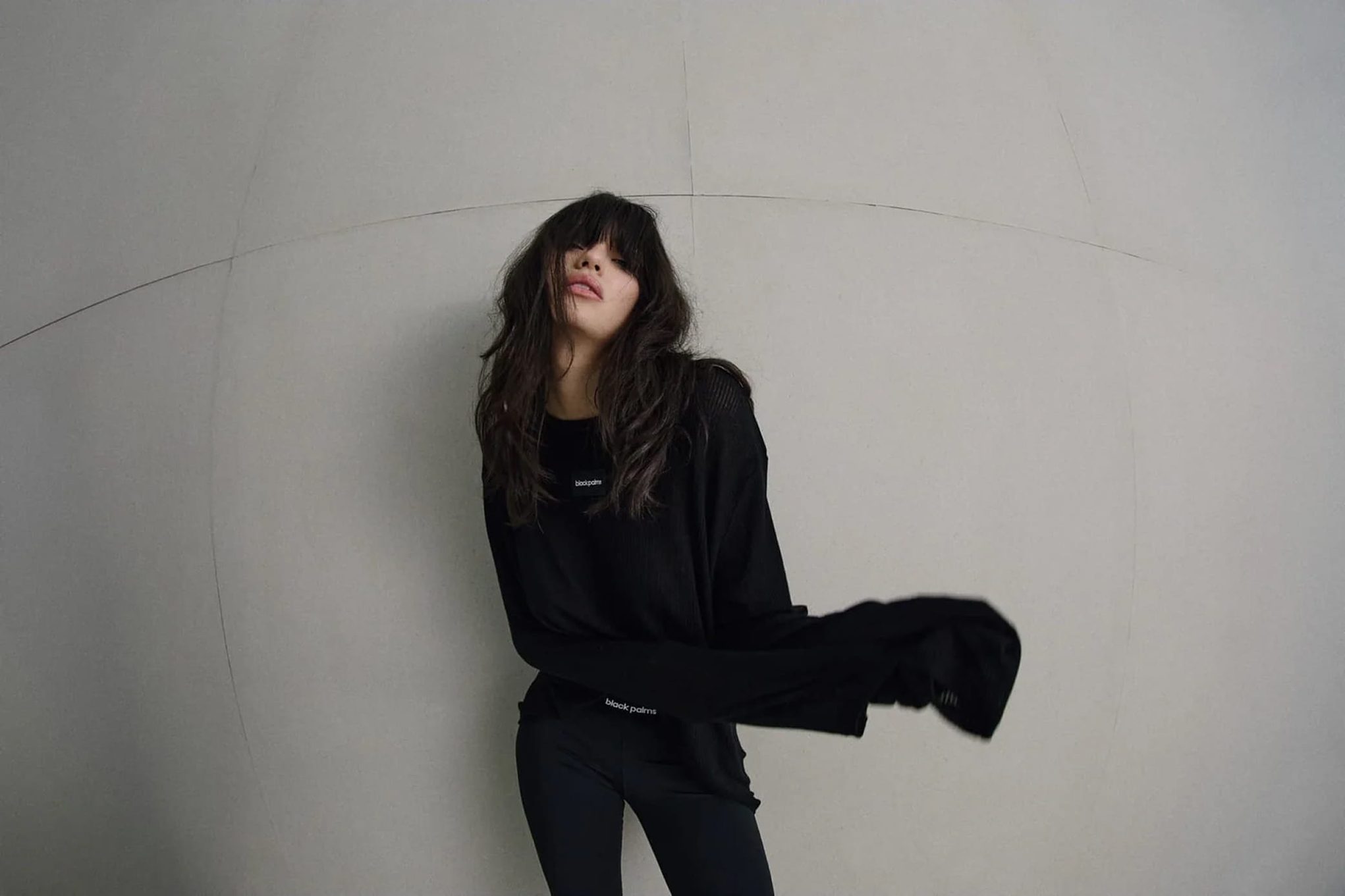 model posing in black loungewear