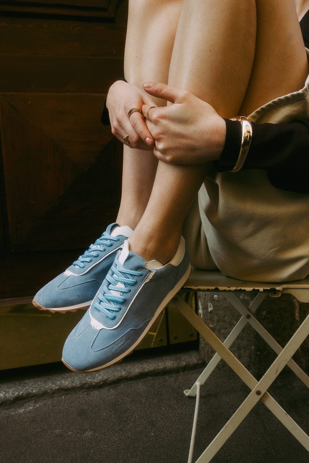 Light blue suede sneakers with white accents.