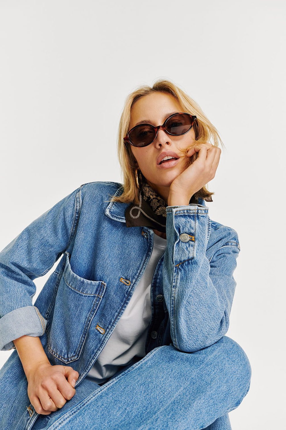 Fashionable woman in denim and sunglasses