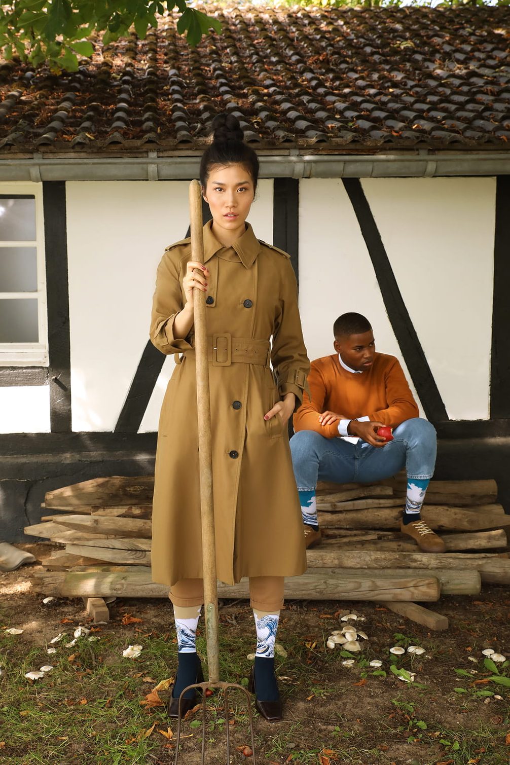 Fashion editorial with models posing outdoors.