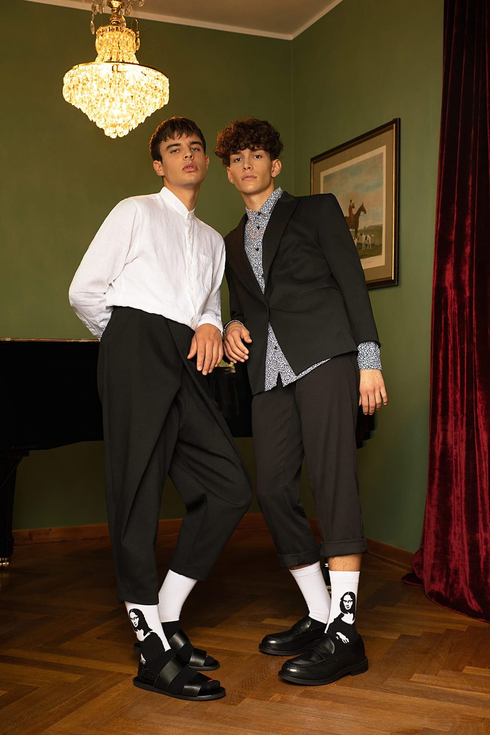 Fashionable models in luxurious setting.