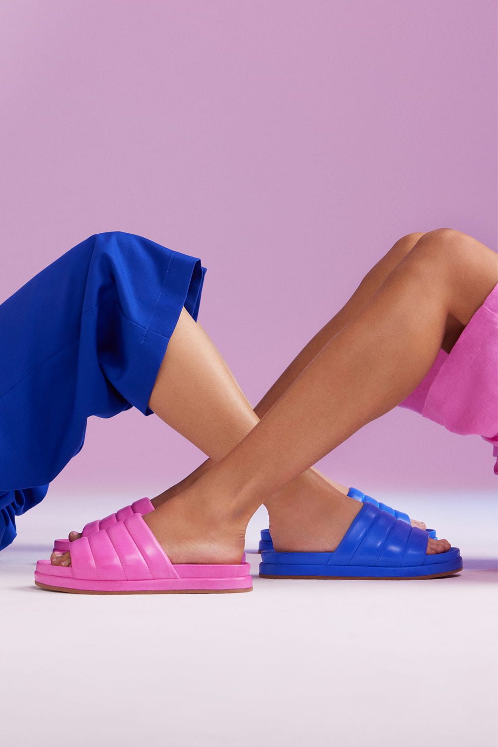 Pink and blue slides with crossed legs