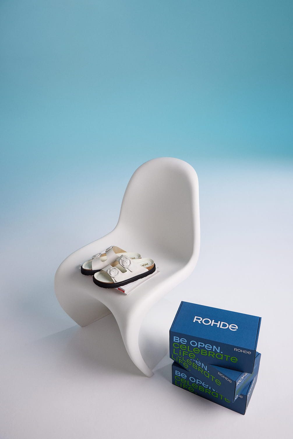 White Rohde sandals on a white chair