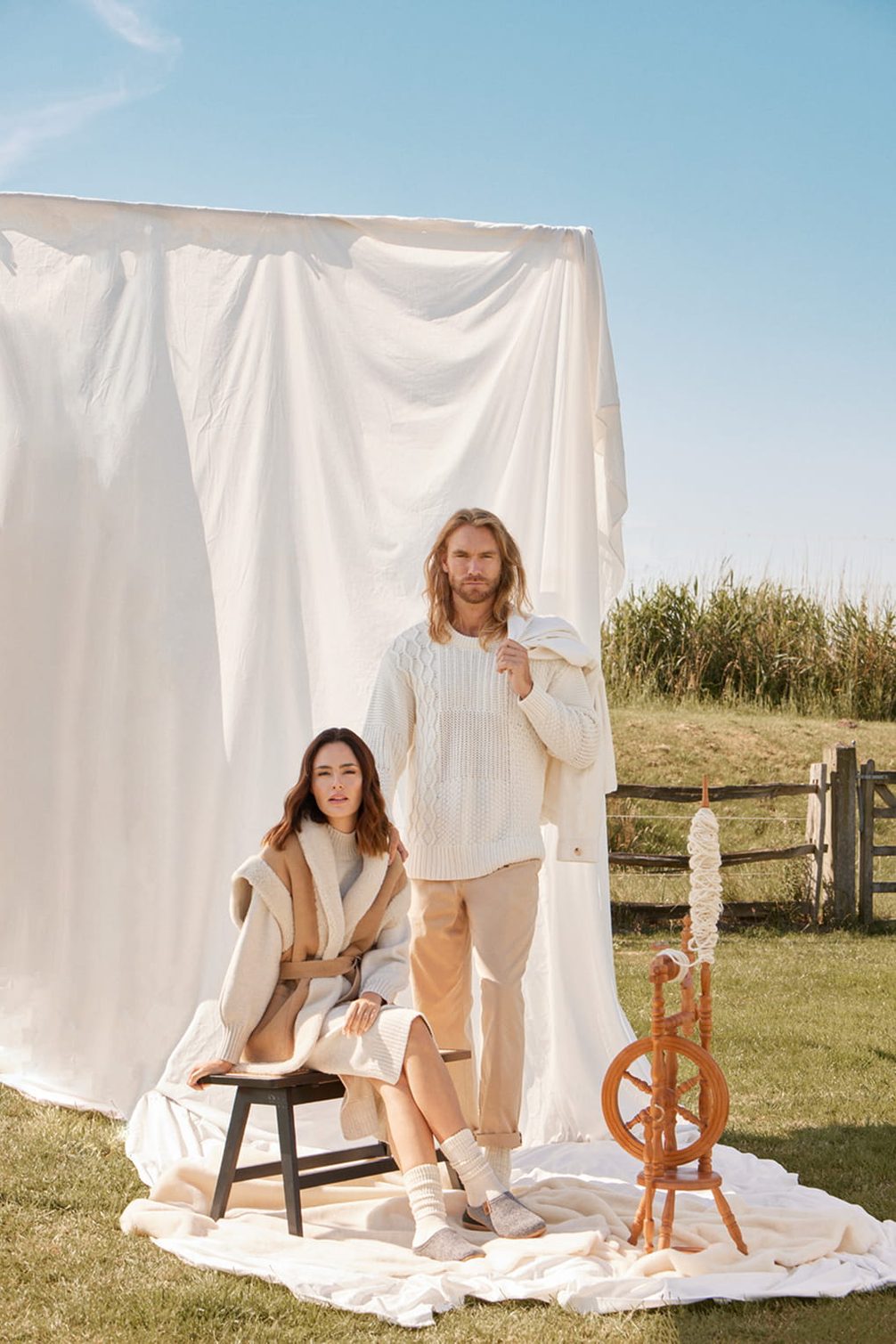 Fashion editorial with models and spinning wheel.