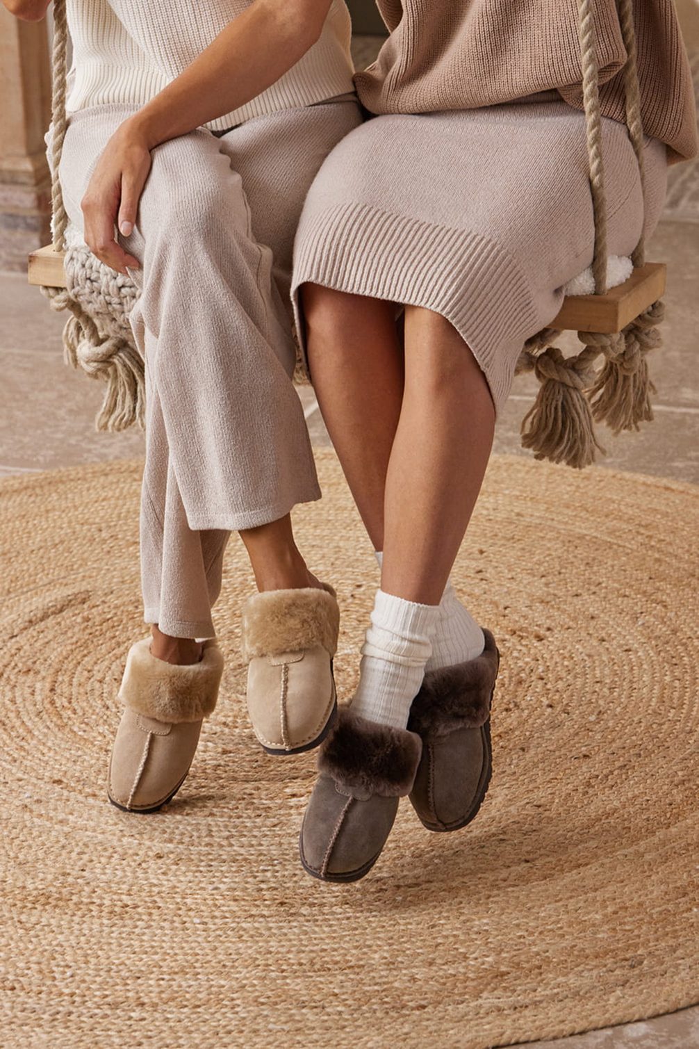 Cozy shearling slippers on a rustic rug