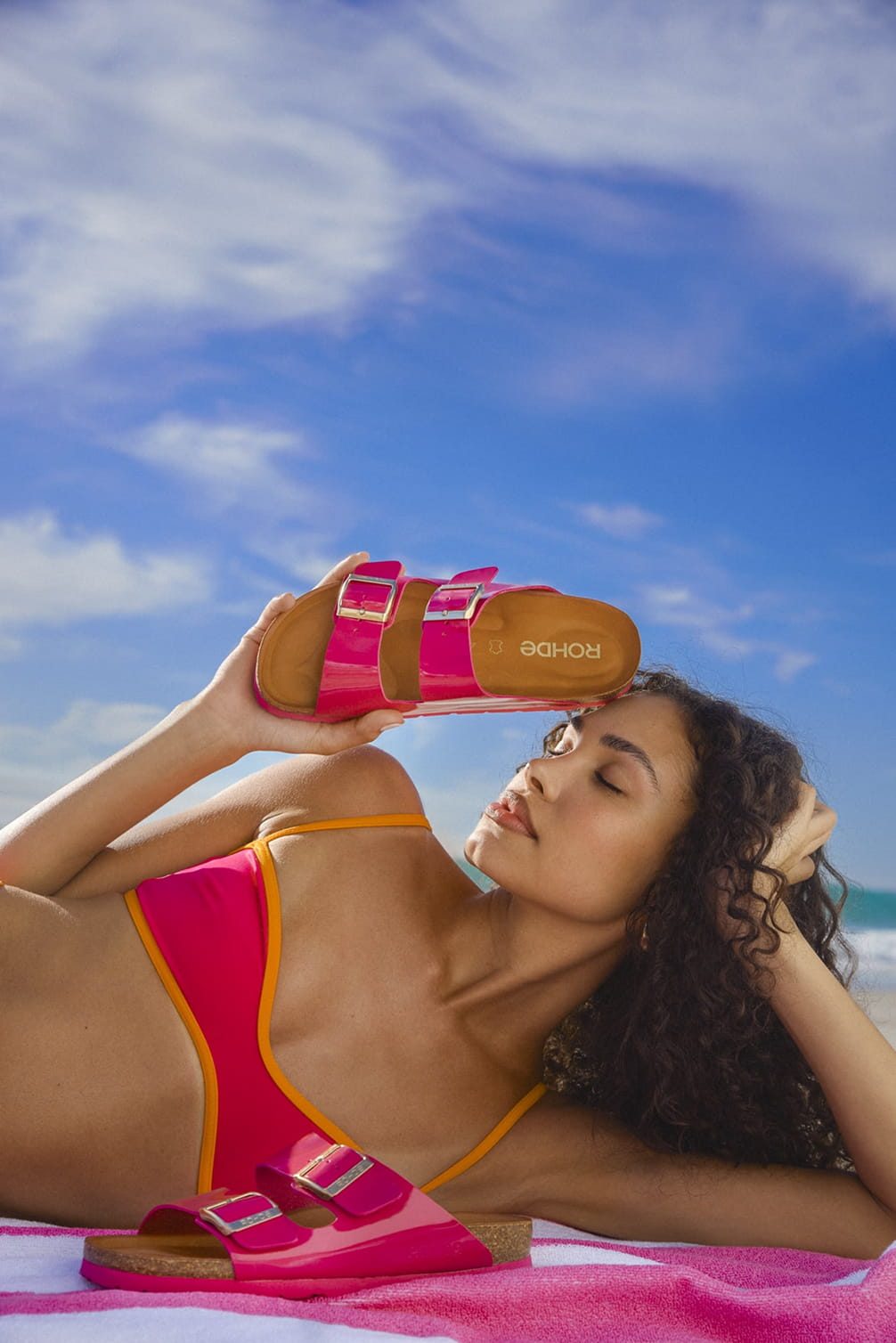 Pink sandals model on the beach